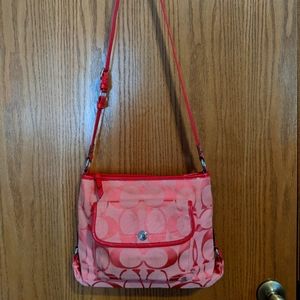 Signature Coach coral crossbody purse